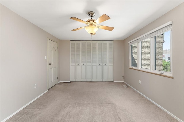 17 Maple Ct, Ross Twp, PA 15237 - unfurnished bedroom featuring baseboards, light carpet, and a ceiling fan