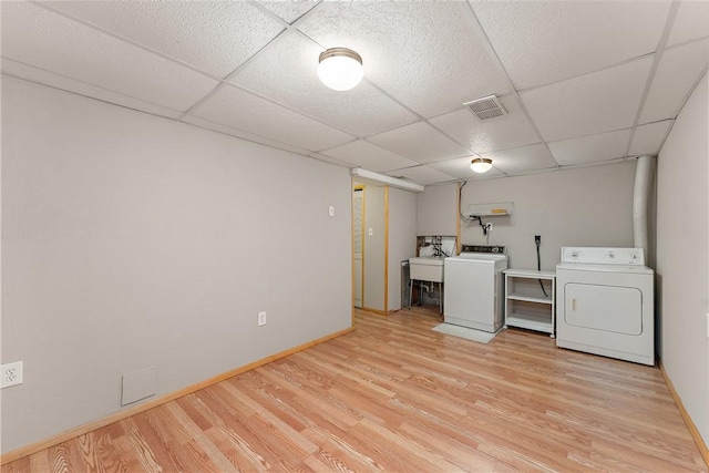 17 Maple Ct, Ross Twp, PA 15237 - laundry area featuring washing machine and dryer, light wood-style flooring, and baseboards