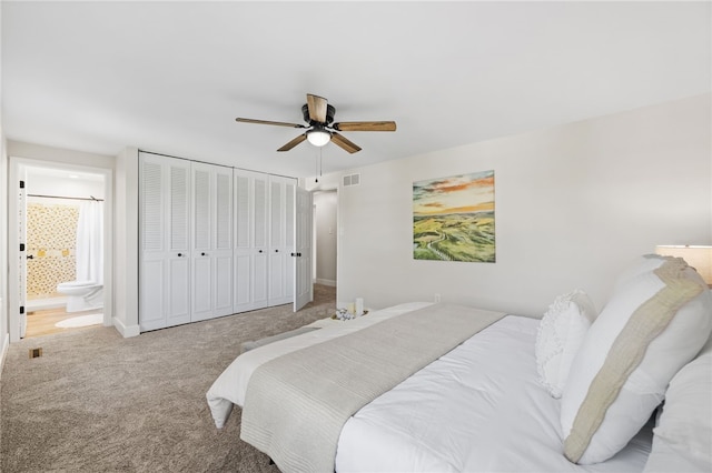 bedroom with carpet flooring, connected bathroom, ceiling fan, and baseboards