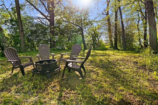 view of yard with a fire pit