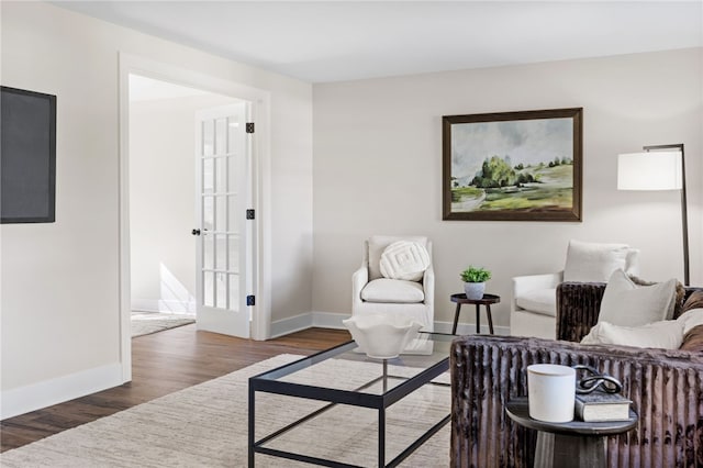 living room with wood finished floors and baseboards