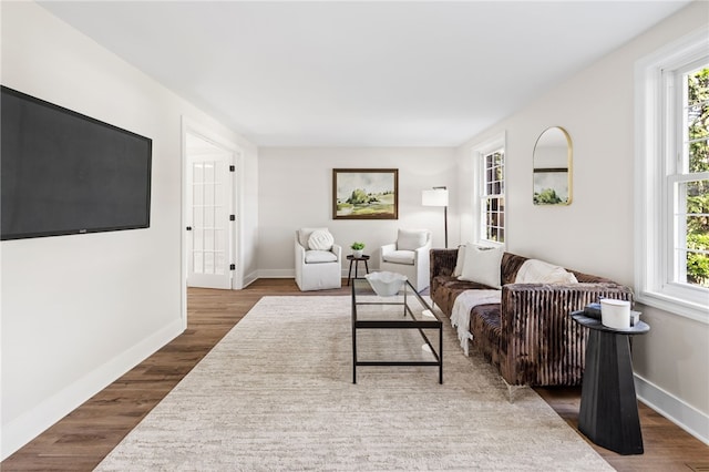 living room with wood finished floors and baseboards