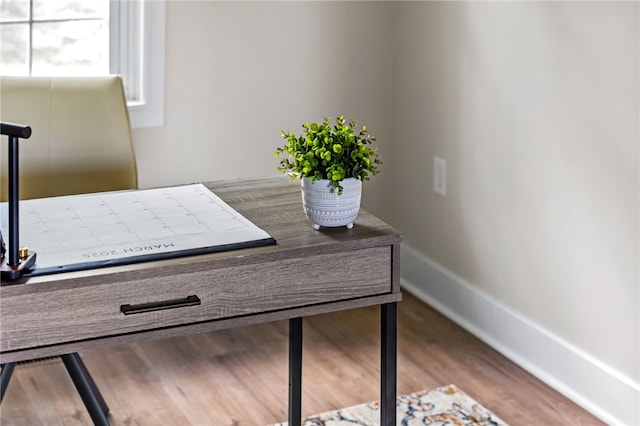 detailed view of baseboards and wood finished floors