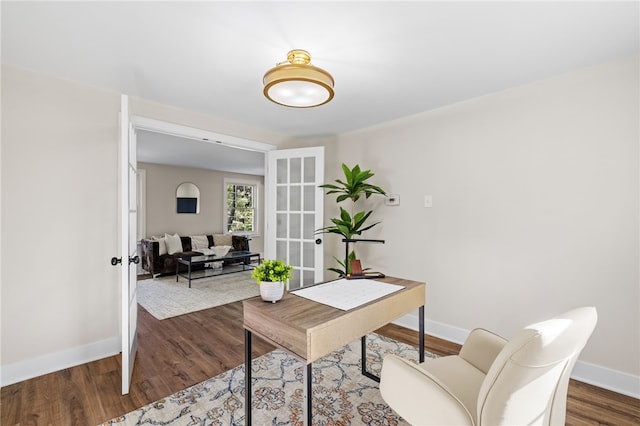 office area with french doors, wood finished floors, and baseboards