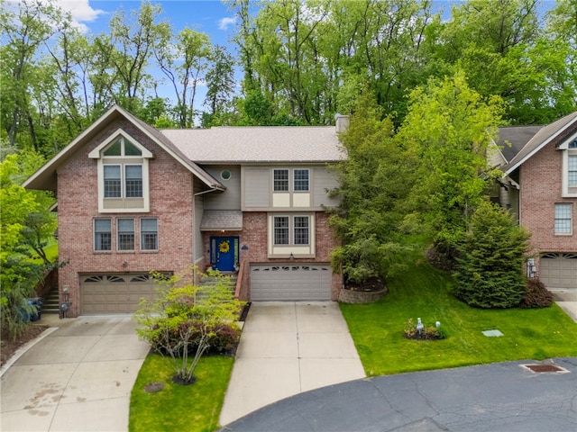 view of front of home featuring an attached garage, brick siding, and driveway