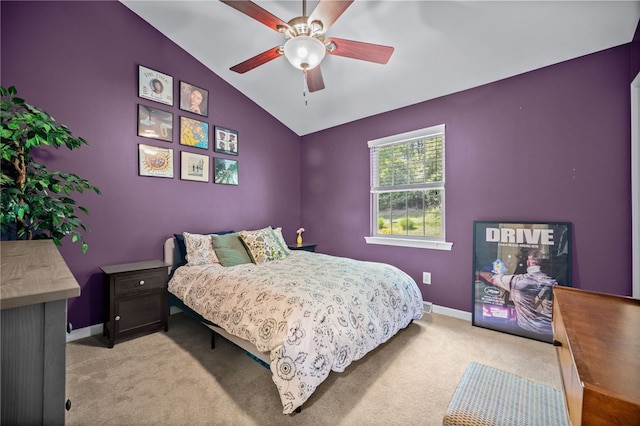 bedroom with lofted ceiling, light carpet, baseboards, and a ceiling fan