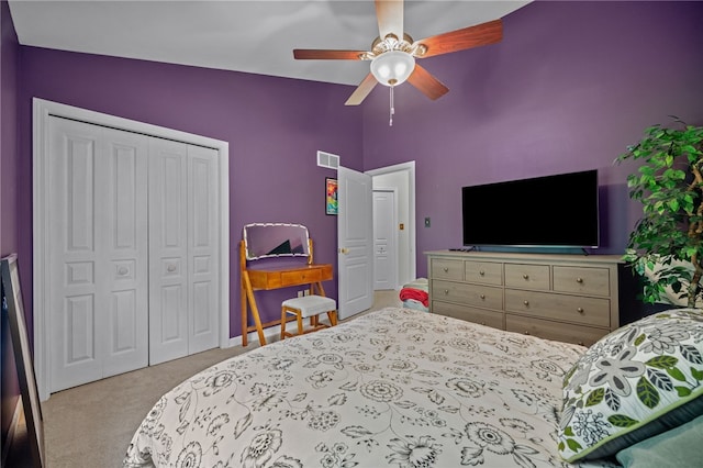 bedroom featuring carpet flooring, a closet, ceiling fan, vaulted ceiling, and baseboards
