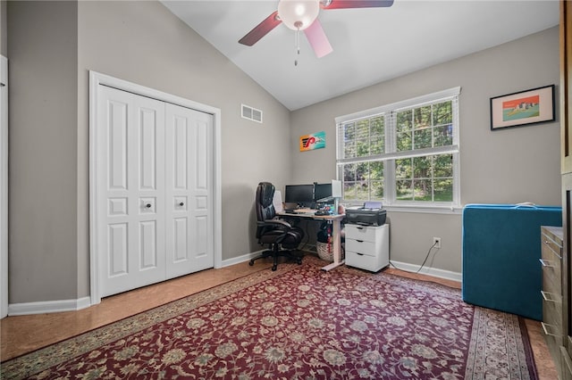 office featuring vaulted ceiling, a ceiling fan, and baseboards