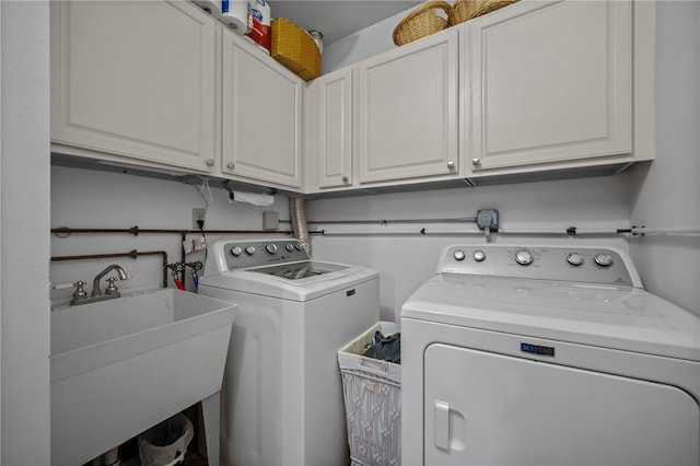 laundry area featuring cabinet space and independent washer and dryer