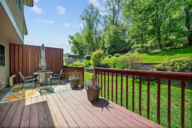 wooden terrace with outdoor dining space