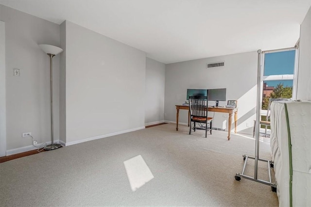 office space featuring carpet flooring and baseboards