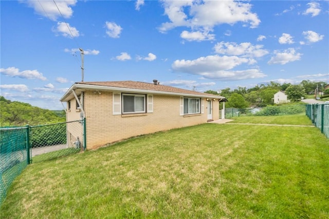 back of property featuring brick siding