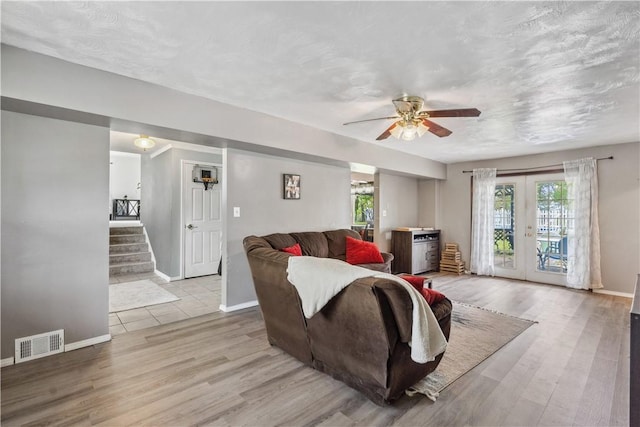 106 Boyanna Dr, Industry, PA 15052 - living room with plenty of natural light, ceiling fan, wood finished floors, and baseboards