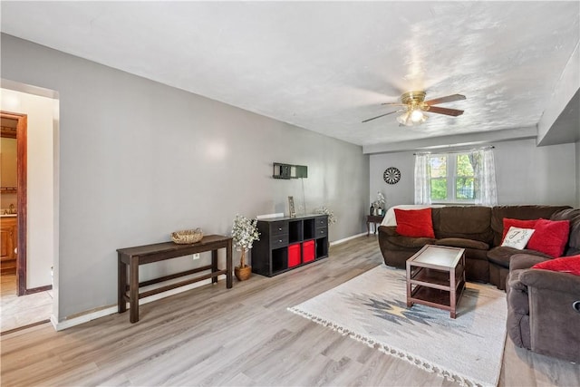 106 Boyanna Dr, Industry, PA 15052 - living area with wood finished floors, a ceiling fan, and baseboards