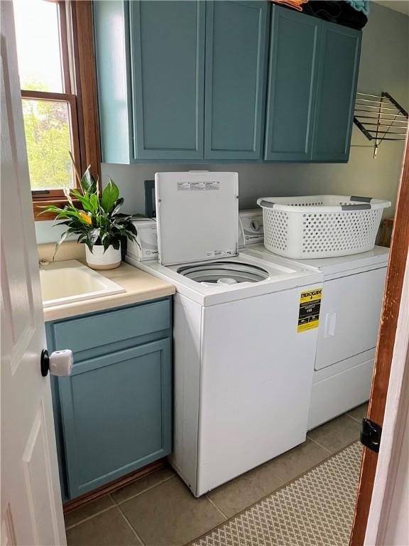 1016 Timberwood Ct, Murrysville, PA 15668 - washroom with cabinet space, washer and clothes dryer, and light tile patterned floors