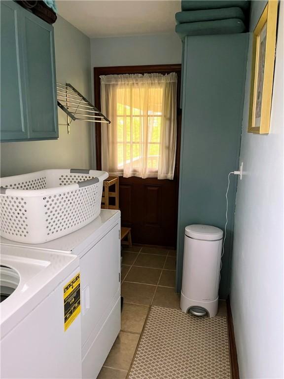 1016 Timberwood Ct, Murrysville, PA 15668 - clothes washing area featuring cabinet space, washing machine and dryer, and light tile patterned flooring