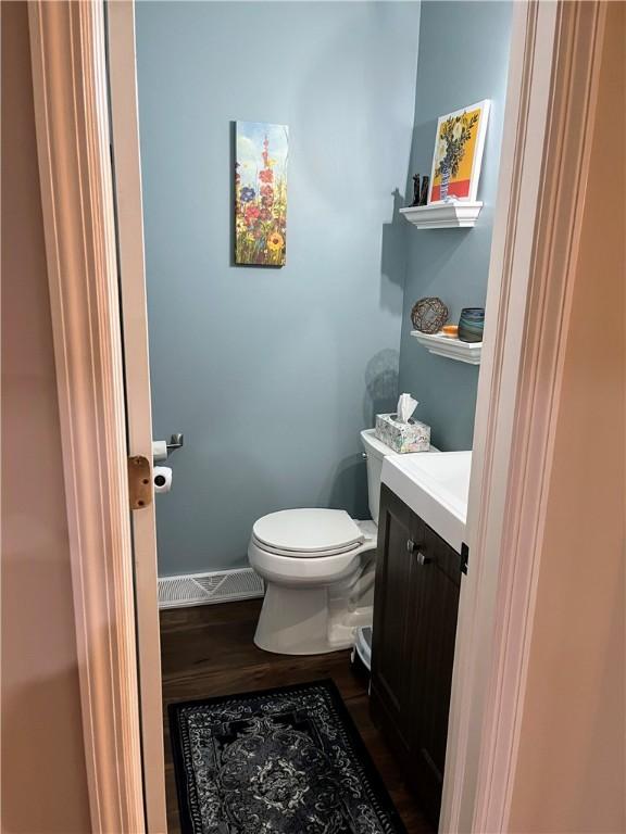 1016 Timberwood Ct, Murrysville, PA 15668 - bathroom featuring toilet, wood finished floors, vanity, and baseboards