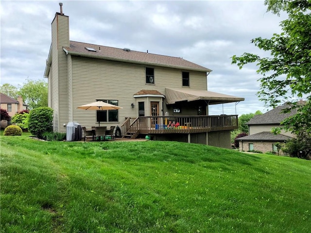 1016 Timberwood Ct, Murrysville, PA 15668 - back of property with a deck, a chimney, and a lawn