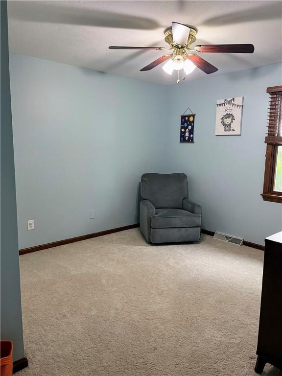 1016 Timberwood Ct, Murrysville, PA 15668 - living area with a ceiling fan, light carpet, and baseboards