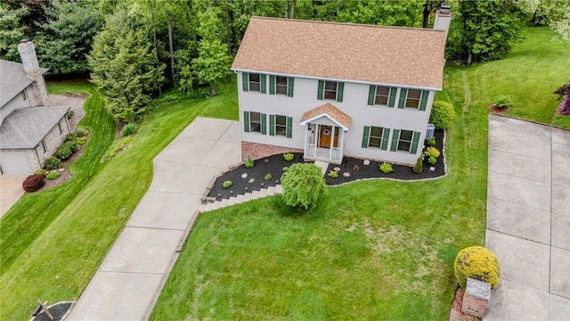 1016 Timberwood Ct, Murrysville, PA 15668 - colonial inspired home with a chimney, a front yard, and roof with shingles