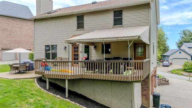 1016 Timberwood Ct, Murrysville, PA 15668 - rear view of property with a deck, outdoor dining space, a chimney, and a patio area