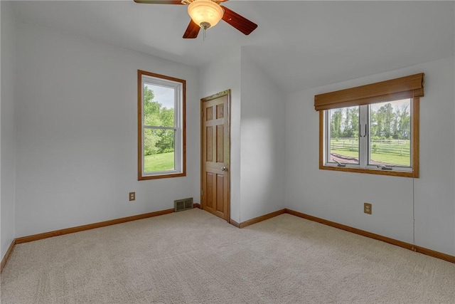 584 Park Rd, Chippewa Twp, PA 15010 - unfurnished room featuring plenty of natural light, light carpet, baseboards, and vaulted ceiling