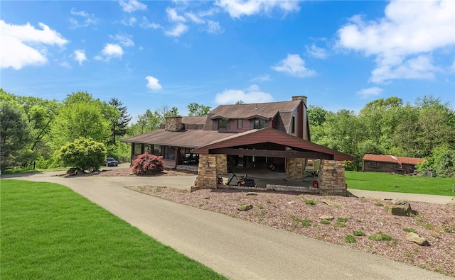584 Park Rd, Chippewa Twp, PA 15010 - view of front of property with a front yard, a chimney, covered porch, and stone siding