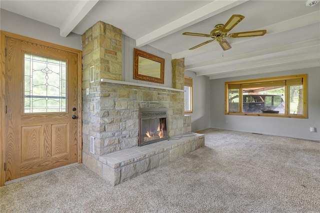 584 Park Rd, Chippewa Twp, PA 15010 - unfurnished living room with beamed ceiling, healthy amount of natural light, a fireplace, carpet flooring, and a ceiling fan