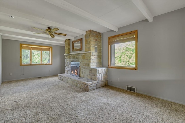 584 Park Rd, Chippewa Twp, PA 15010 - unfurnished living room featuring beamed ceiling, a fireplace, baseboards, carpet, and ceiling fan