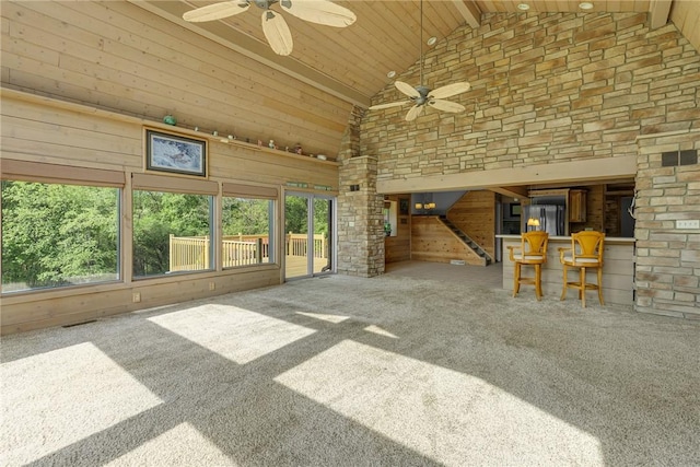 584 Park Rd, Chippewa Twp, PA 15010 - unfurnished living room with high vaulted ceiling, ceiling fan, carpet flooring, wooden ceiling, and wooden walls