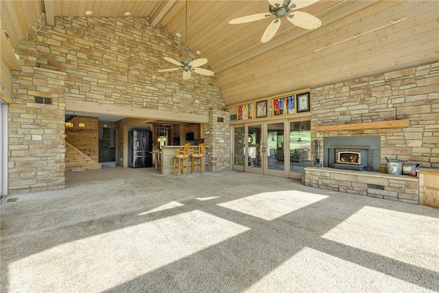 584 Park Rd, Chippewa Twp, PA 15010 - unfurnished living room featuring high vaulted ceiling, an outdoor stone fireplace, a ceiling fan, carpet floors, and wood ceiling