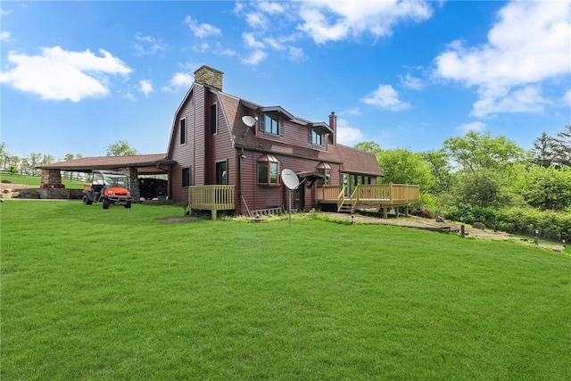 584 Park Rd, Chippewa Twp, PA 15010 - back of house with a chimney, a yard, a wooden deck, and a gambrel roof