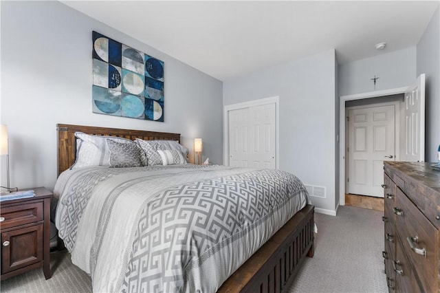 bedroom with light carpet, a closet, and baseboards