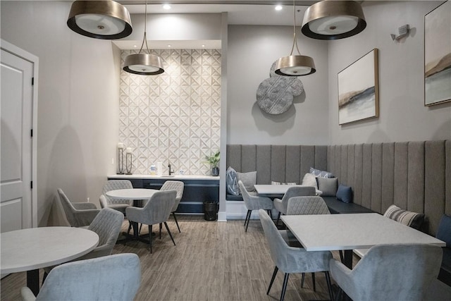 dining space with recessed lighting and wood finished floors