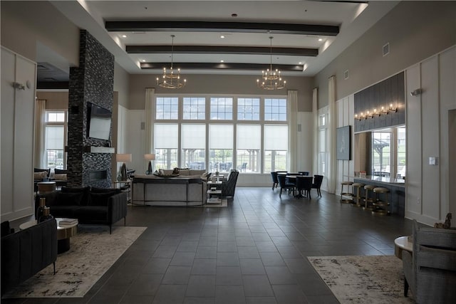 building lobby featuring a high ceiling and beamed ceiling