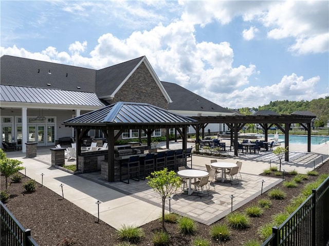 surrounding community featuring a gazebo, a swimming pool, and a patio