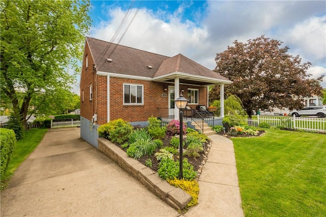 bungalow-style house featuring a porch, brick siding, and a shingled roof