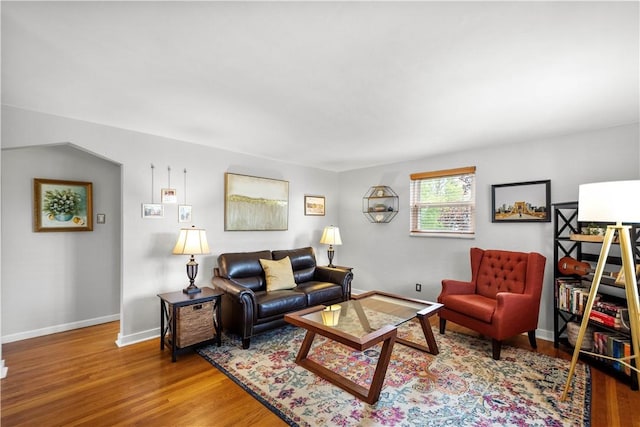 living area with wood finished floors and baseboards