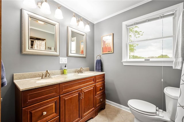 bathroom featuring toilet, crown molding, tile patterned flooring, double vanity, and baseboards
