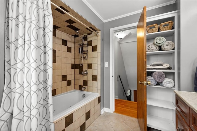 full bath featuring tiled shower / bath, tile patterned floors, crown molding, and vanity