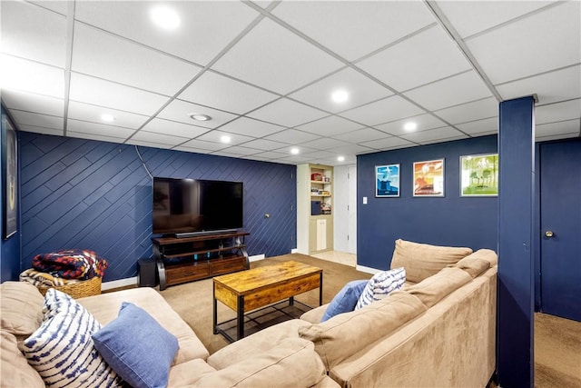living area featuring carpet floors, recessed lighting, a paneled ceiling, baseboards, and built in features