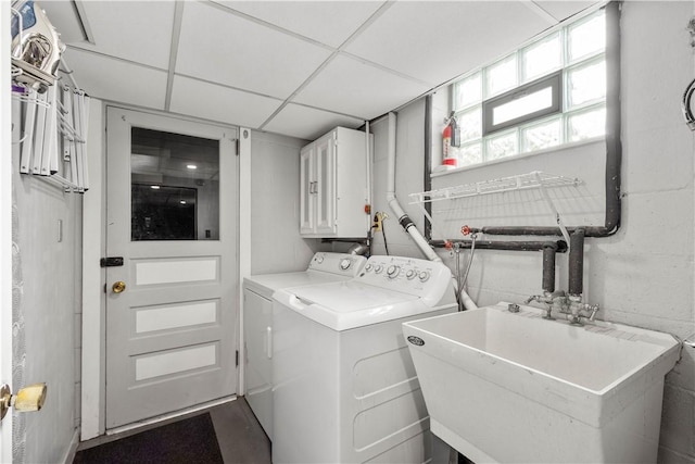 washroom featuring cabinet space and washing machine and dryer