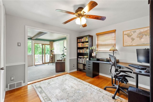 office area featuring a ceiling fan, wood finished floors, and baseboards