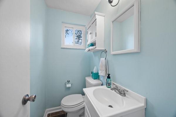 930 Illinois Ave, Mt Lebanon, PA 15216 - half bathroom featuring toilet, vanity, and baseboards