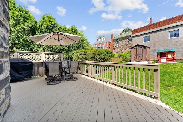 4030 Dalewood St, Brentwood, PA 15227 - wooden deck featuring a storage shed, outdoor dining area, grilling area, a lawn, and an outbuilding