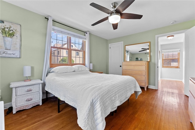 4030 Dalewood St, Brentwood, PA 15227 - bedroom with wood finished floors, multiple windows, and baseboards