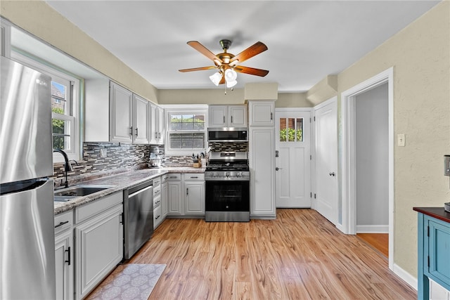 4030 Dalewood St, Brentwood, PA 15227 - kitchen with appliances with stainless steel finishes, a sink, healthy amount of natural light, and a ceiling fan