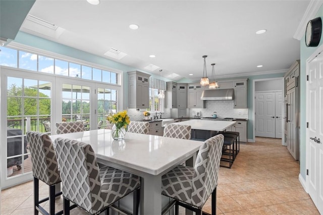 dining room featuring light tile patterned floors, recessed lighting, and crown molding