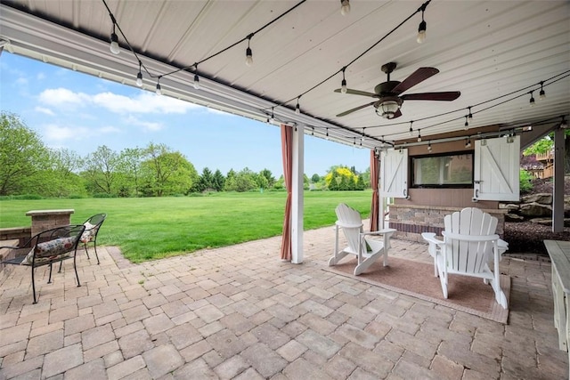 view of patio featuring a ceiling fan