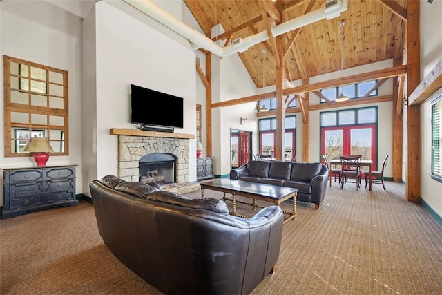 carpeted living area with high vaulted ceiling, a fireplace, baseboards, and wood ceiling